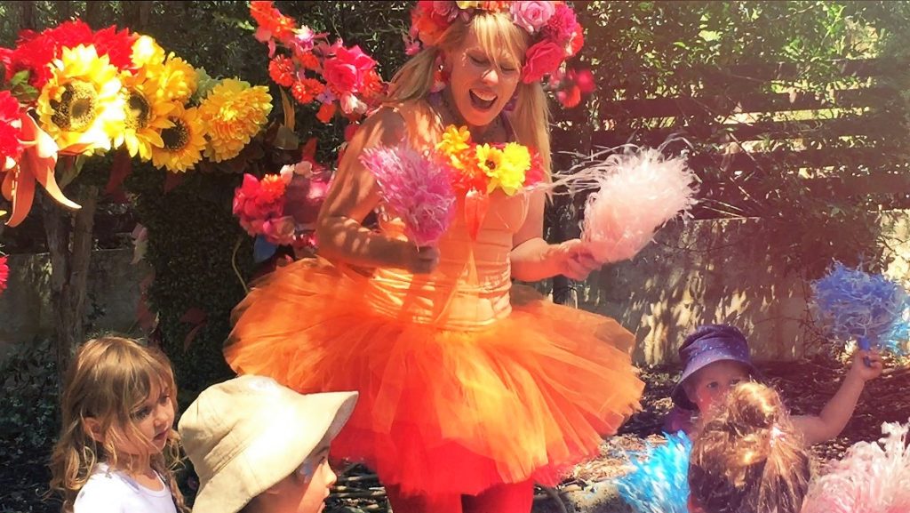 A woman in a tutu and flowers.