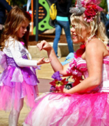 A woman and a girl in clothing.