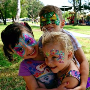 A group of kids with face paint.