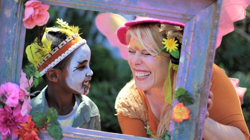 A woman and a boy looking at each other.