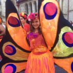 A woman dressed as a butterfly.