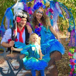 A family dressed up as a fairy and a little girl.