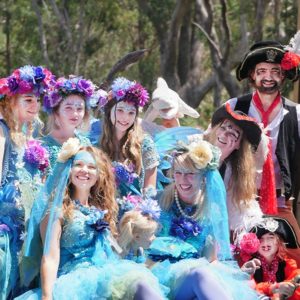 A group of people dressed as pirates posing for a photo.