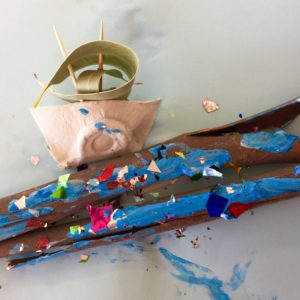 A stick with a boat on top of it.